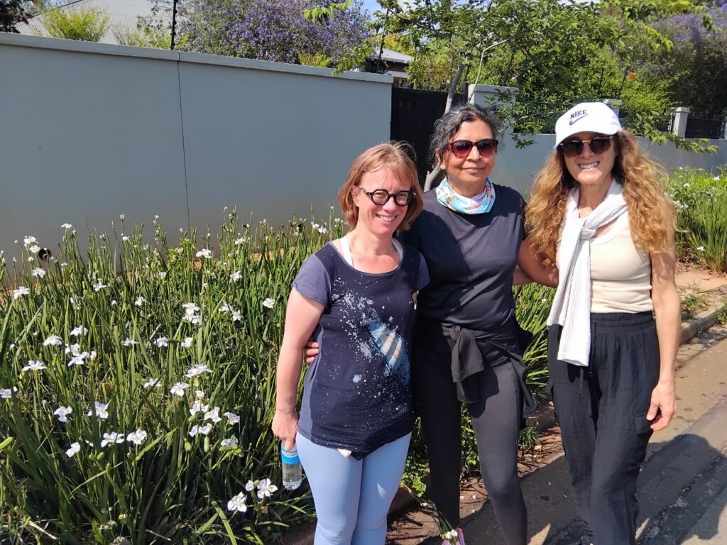Friends enjoying the Westcliff Stairs Walk among Spring flowers in Johannesburg